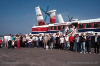 Passengers lined up alongside the Mk III craft